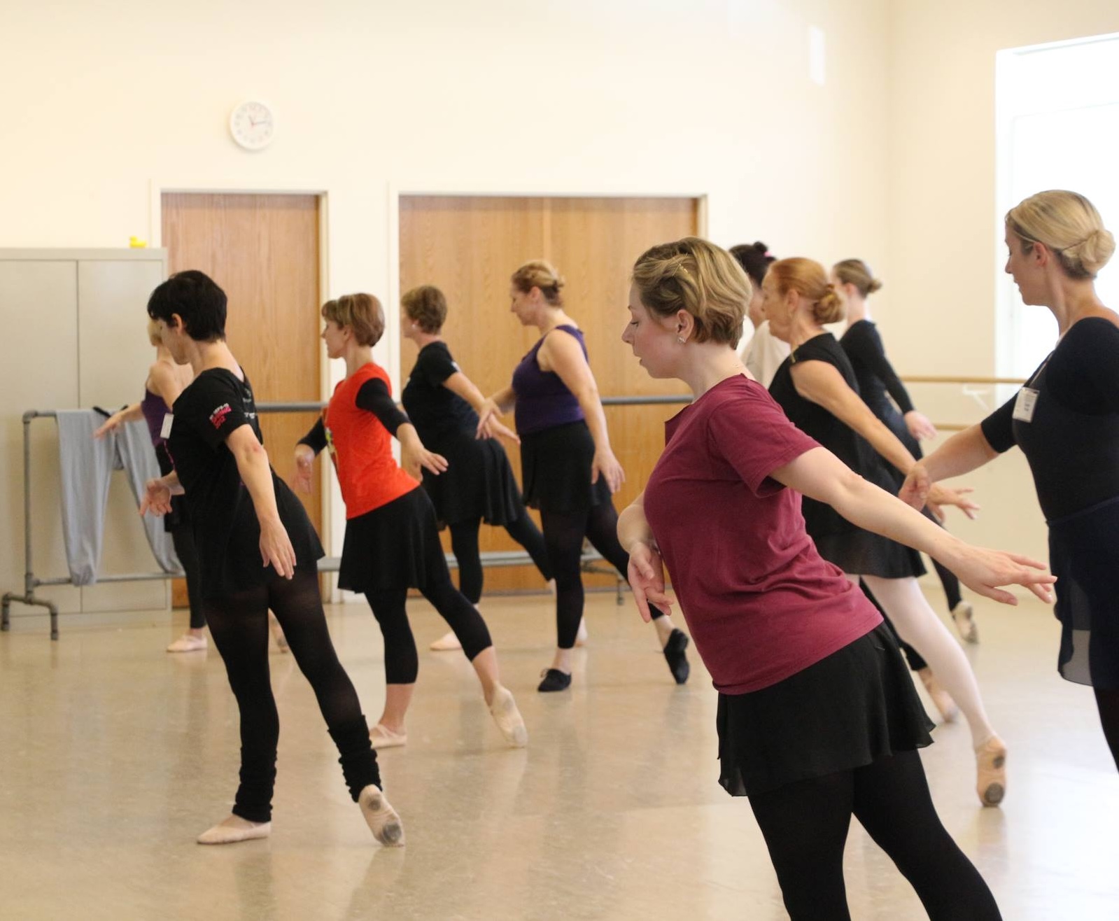 dancers in the middle of dance class, view from the side