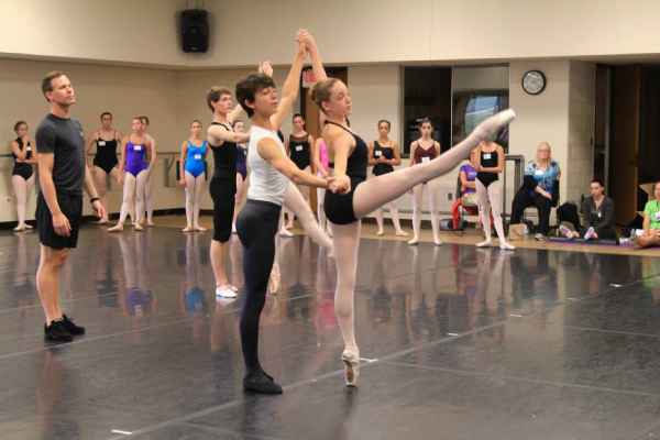 Two dancers practicing in a dance studio