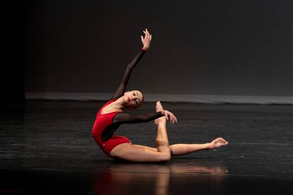 Woman in a ballet position in the ground